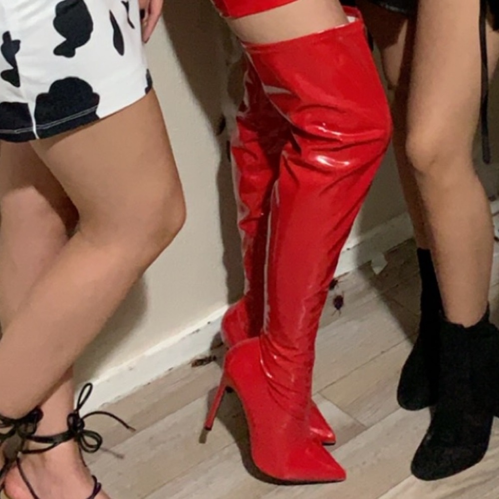 Red latex over the knee boots